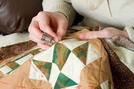 person quilting