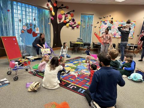 Miss Stephanie reading to the kids for storytime