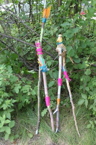 decorated wooden hiking sticks