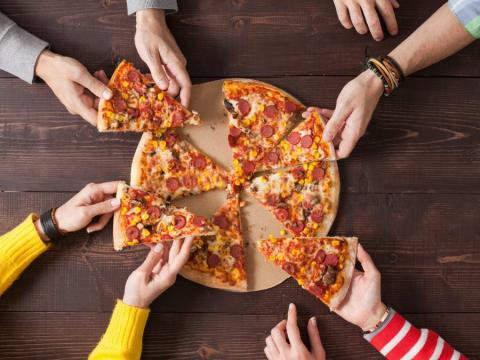 pizza being shared