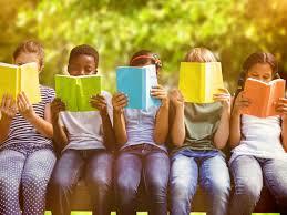children reading outdoors