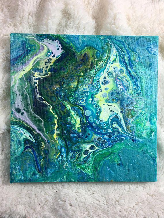 Pour paint canvas in shades of blue and green
