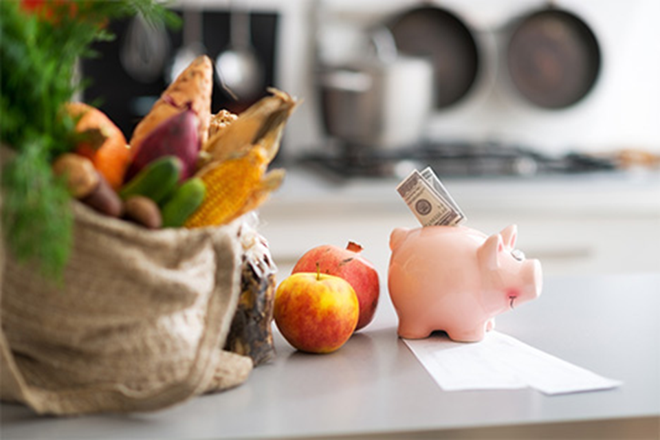 Picture of fresh produce and a piggy bank