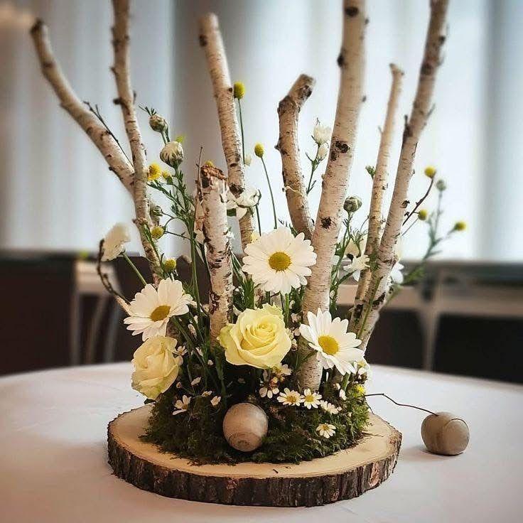 Fall themed centerpiece with flowers and wood